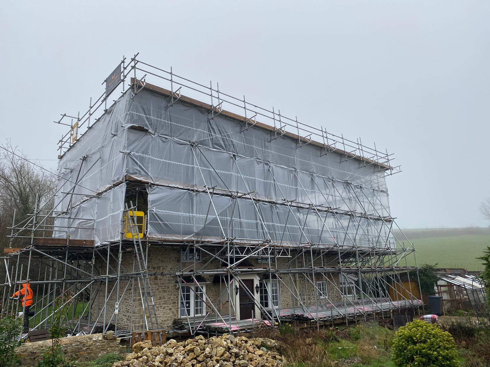 Temporary roof scaffolding protecting building project in East Devon